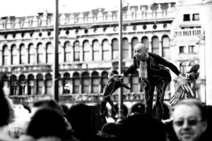Venice-Actor in carnival costume in St. Mark's square, color landscape photo