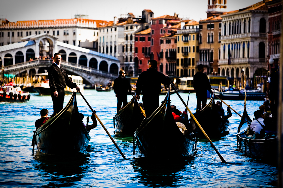 Venice, Italy - gondolas in Grand Canal nearby Rialto Bridge, color photo