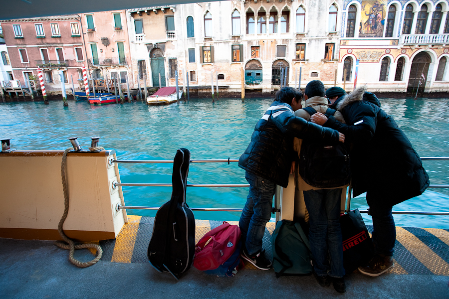 Venice-three boys on a waterbus in Grand Canal
