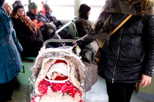 Venice - child in the stroller onboard a water bus, color landscape photo