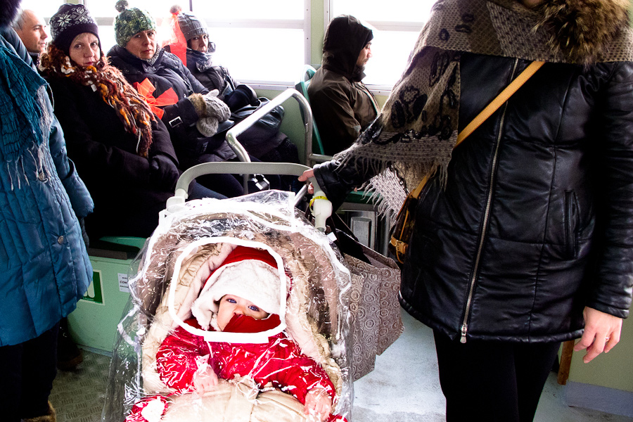 Venice - child in the stroller onboard a water bus, color landscape photo
