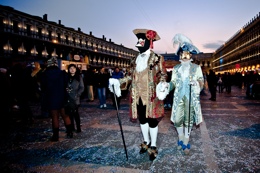Venice - couple in carnival costume in St. Mark's square, color landscape photo