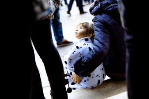Venice - little boy in carnival costume in St. Mark's square, color landscape photo