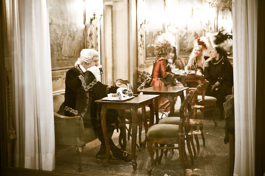 Venice - people in costume at Caffe Quadri in St. Mark's square, landscape color photo