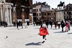 Venice - boy in carnival costume in Campo S. Giovanni e Paolo, color landscape photo