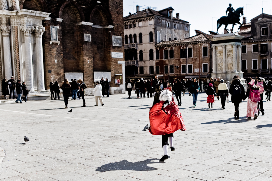 Venice - boy in carnival costume in Campo S. Giovanni e Paolo, color landscape photo