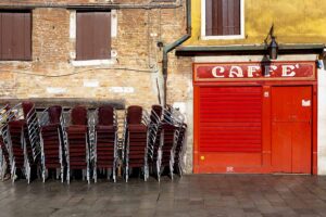 Venice - stacked chairs outside a cafe in S. Margherita square, color landscape photo