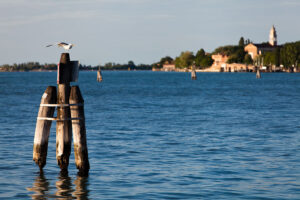 Venice - lagoon at sunset with S. Nicolò abbey in the background, color landscape photo