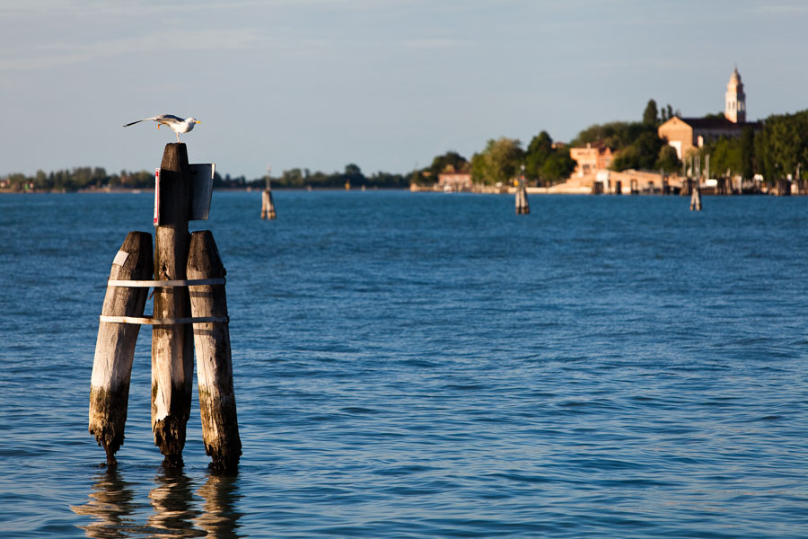 Venice - lagoon at sunset with S. Nicolò abbey in the background, color landscape photo